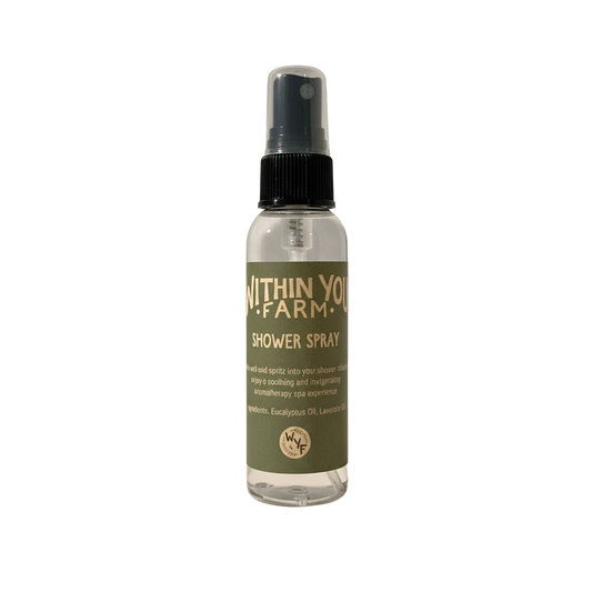 Within You Farm shower spray with eucalyptus and lavender essential oils for a soothing aromatherapy experience. Clear bottle with green label.